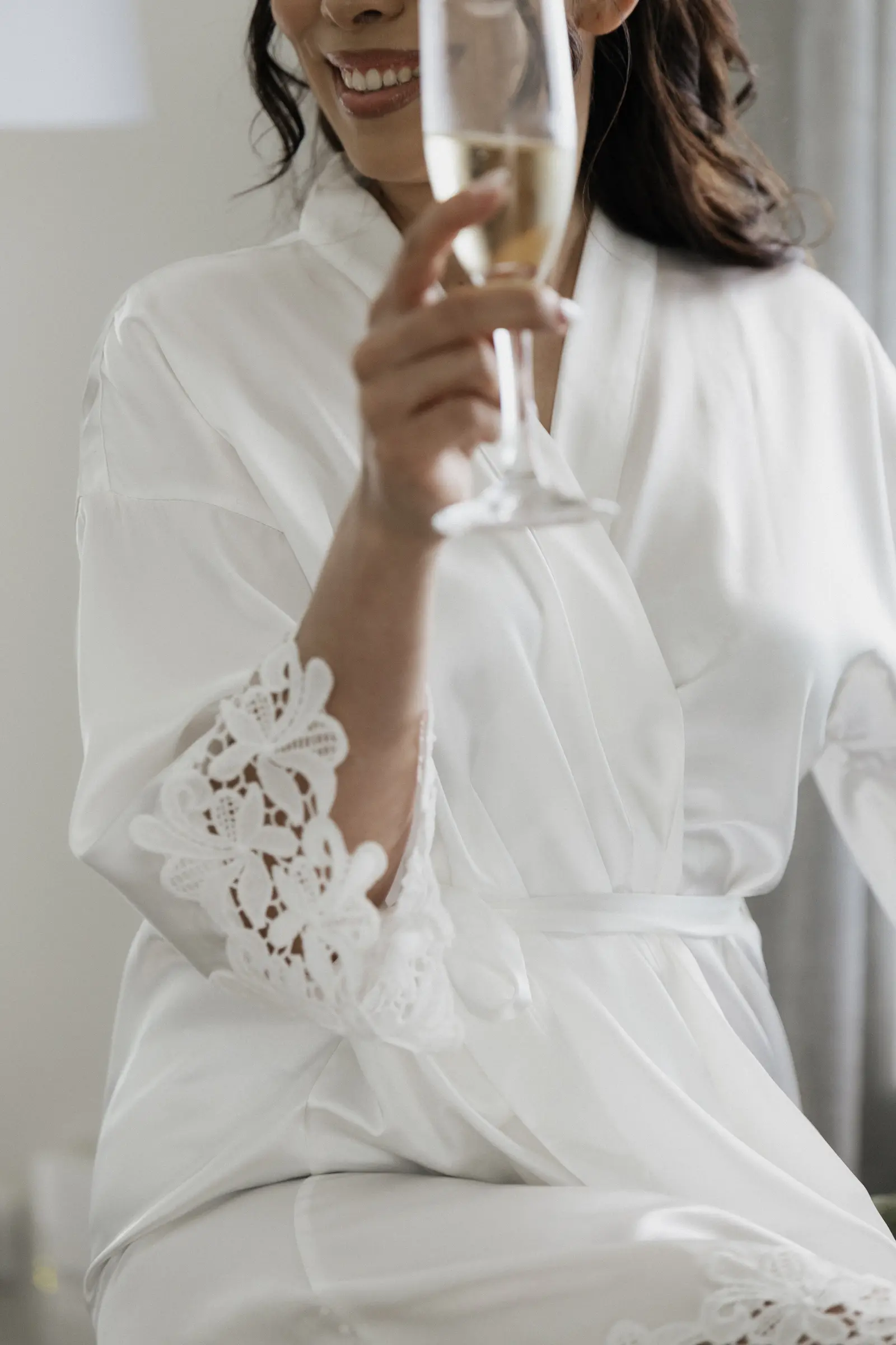 Bride holding a glass of champagne
