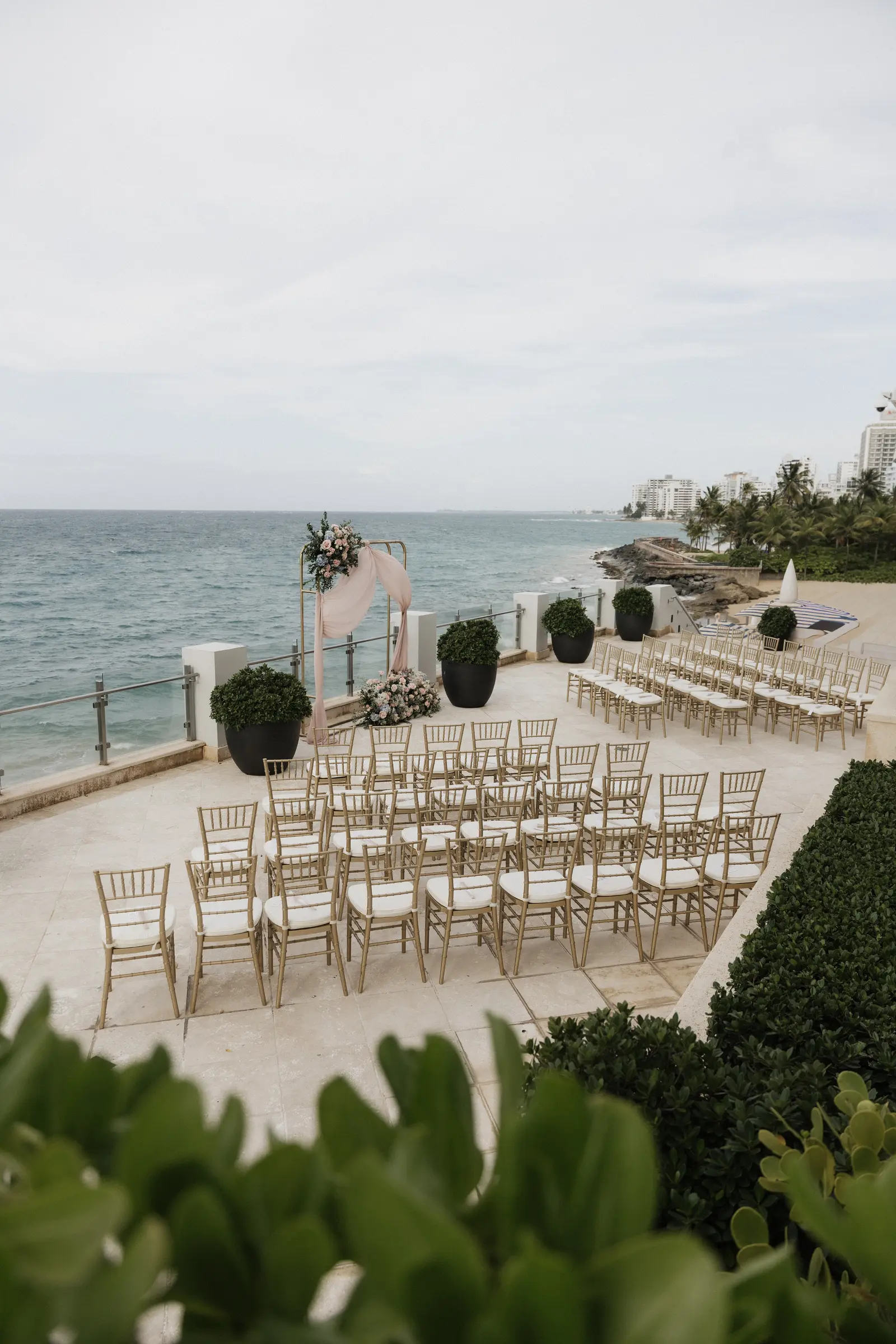 Outdoor wedding ceremony setup overlooking the ocean