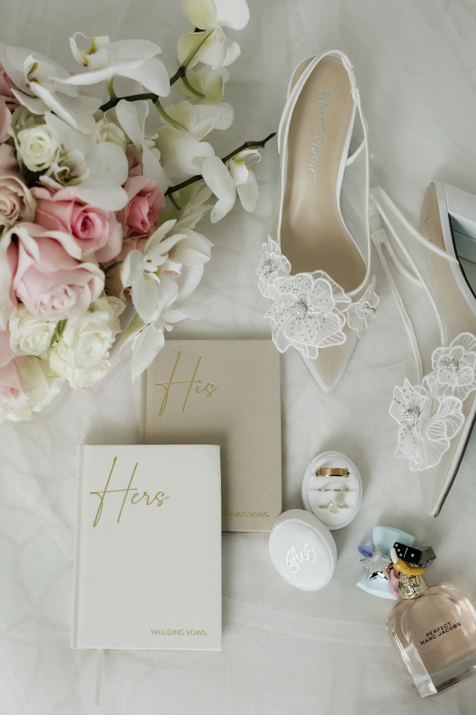Wedding invitation suite with flowers and bridal shoes