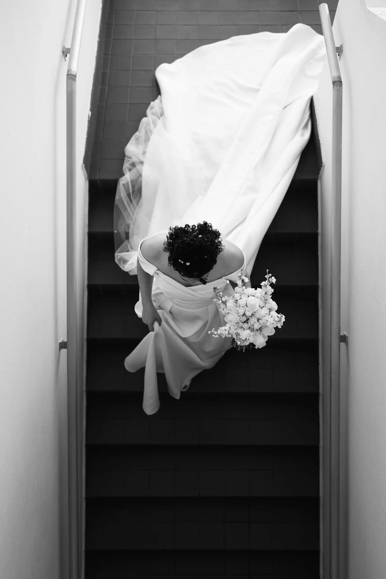 Wedding dress hanging in a stairwell