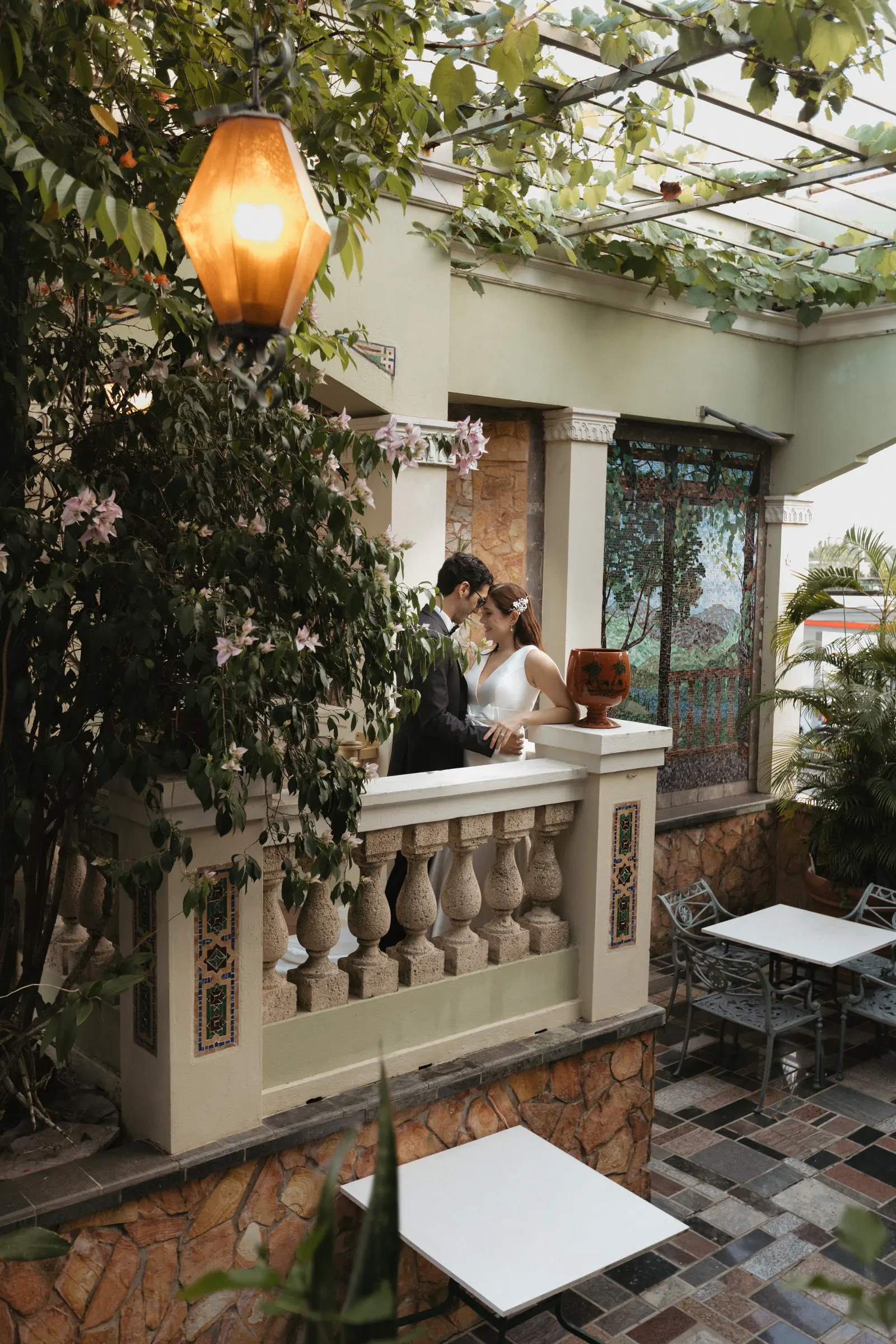 Guests toasting on a candlelit outdoor terrace