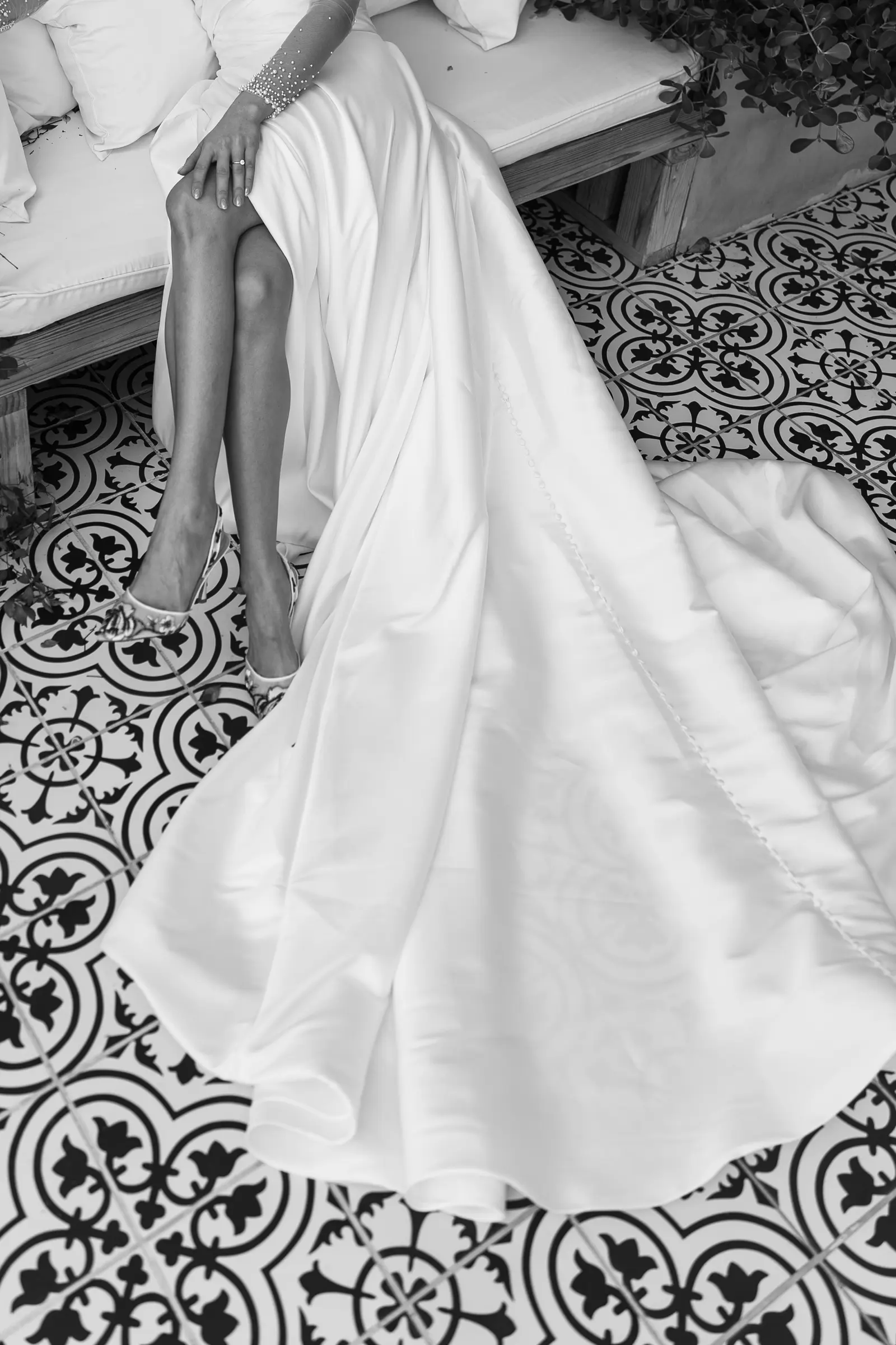 Wedding dress train on a patterned tile floor
