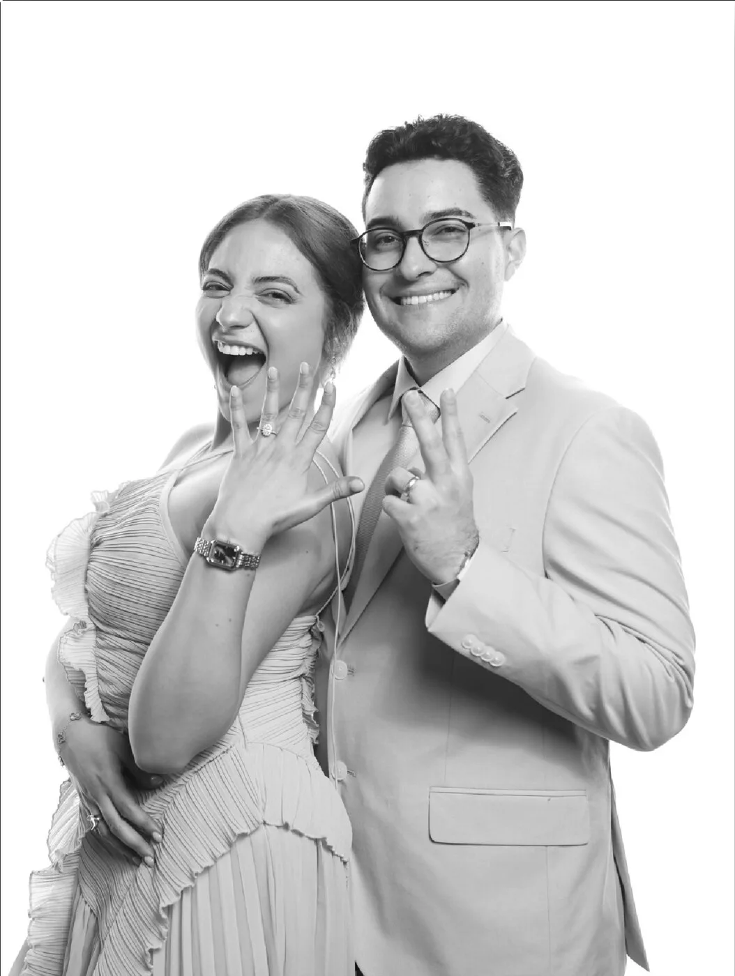 Wedding guests in formal attire posing together for a black and white Bright Studio portrait
