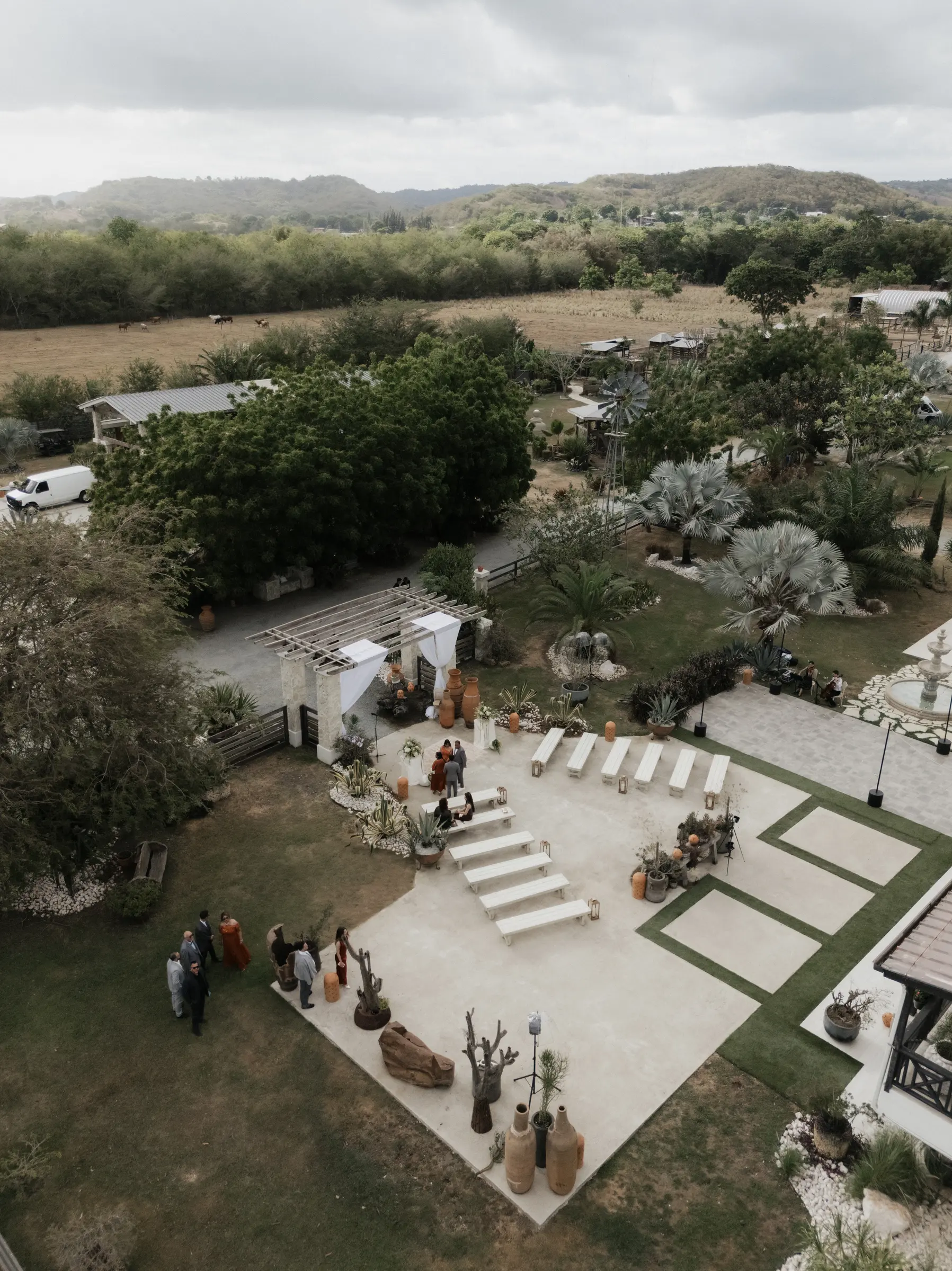 Wedding ceremony in progress under a floral arch in Puerto Rico