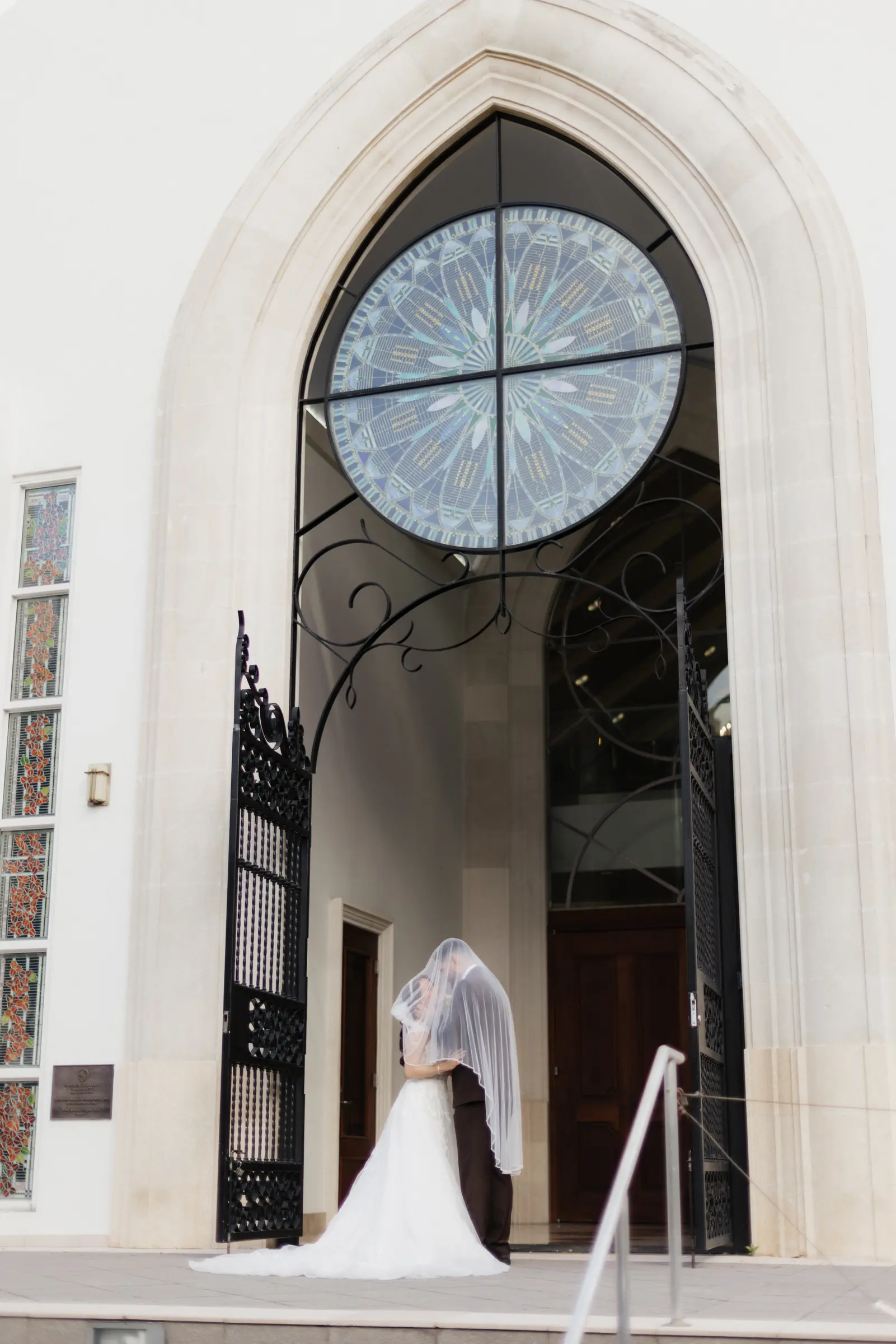 Bride entering through an arched church doorway