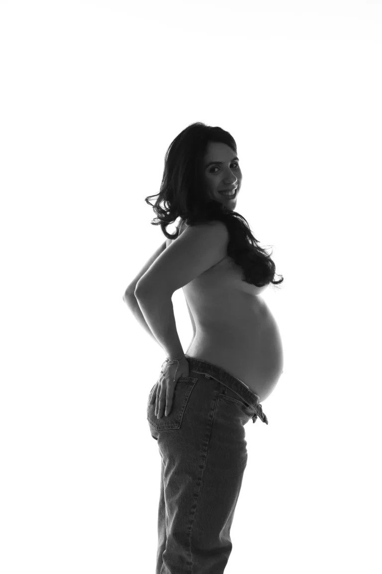 Black and white portrait of a pregnant woman, side profile