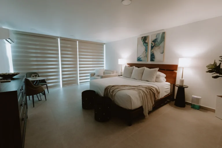 Bright bedroom with sheer curtains and wood furnishings