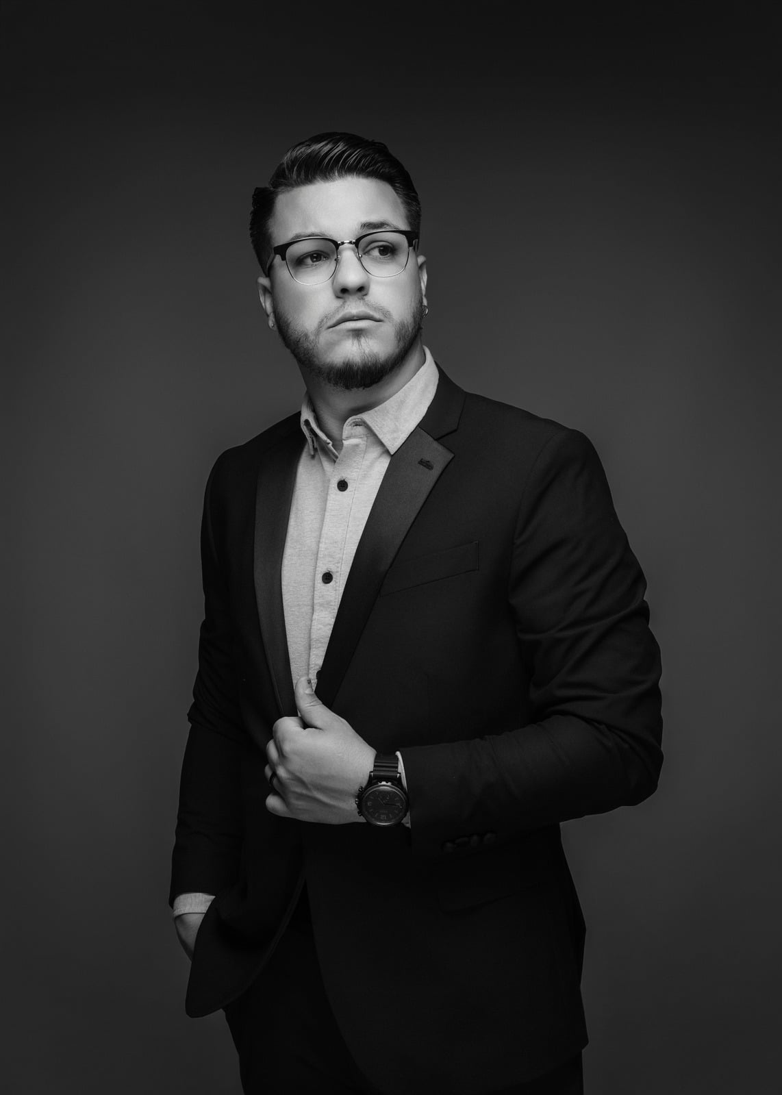 Black and white studio portrait of wedding photographer Will Favinger